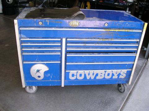 1986 Toyota Hilux - A blue tool chest with the Cowboys logo and text is shown in a garage setting.