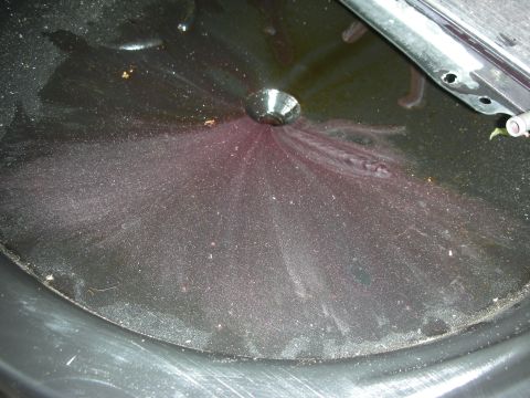 1992 Ford Crown Victoria - This transmission fluid pan shows signs of wear with metal shavings mixed into the fluid.