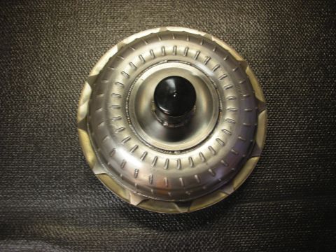 1992 Ford Crown Victoria - A torque converter, a component of an automatic transmission, is shown against a dark background.