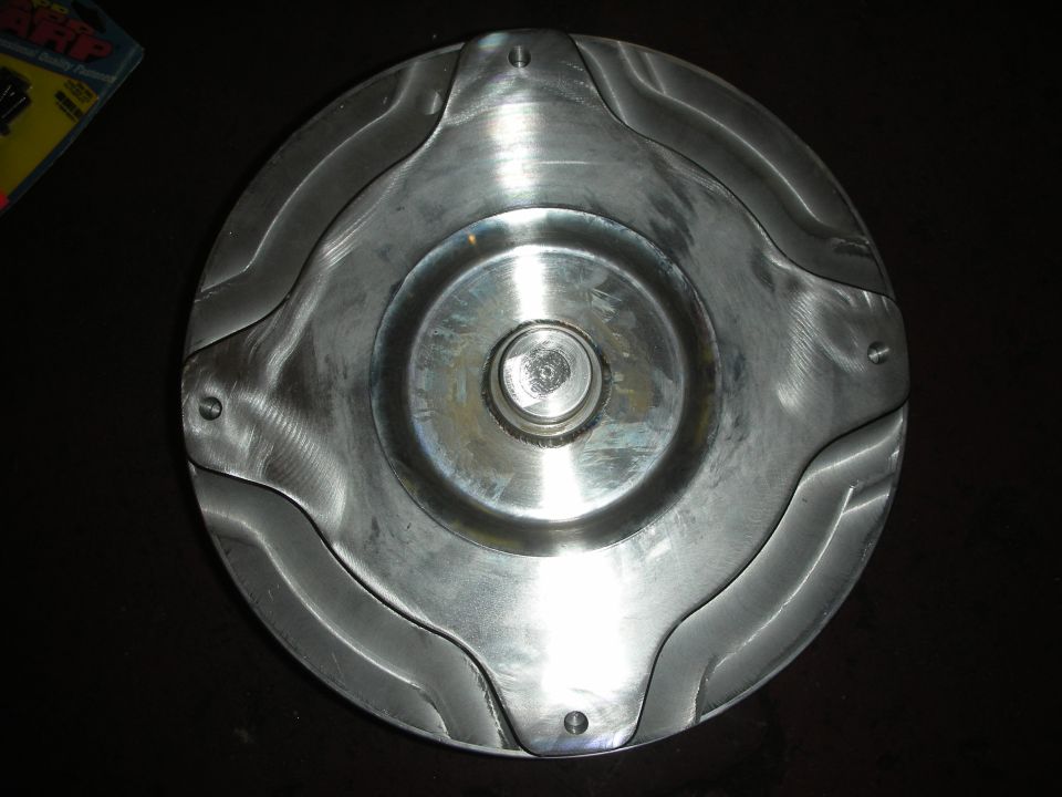 Torque converter with wavy fins and central hub