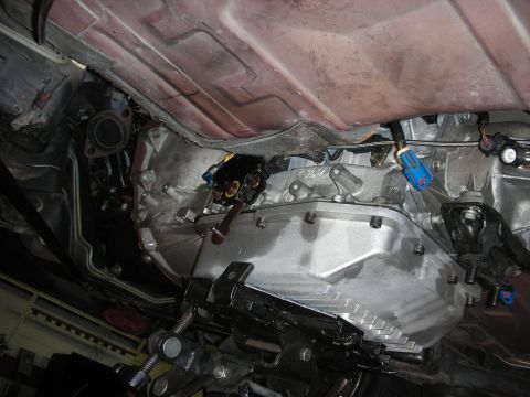 1992 Ford Crown Victoria - Vehicle transmission and exhaust system components are visible from underneath the car.