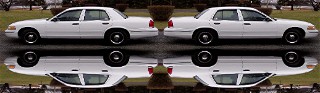 1999 Ford Crown Victoria - Side view of two 1999 Ford Crown Victoria sedans, mirrored in a wet surface.