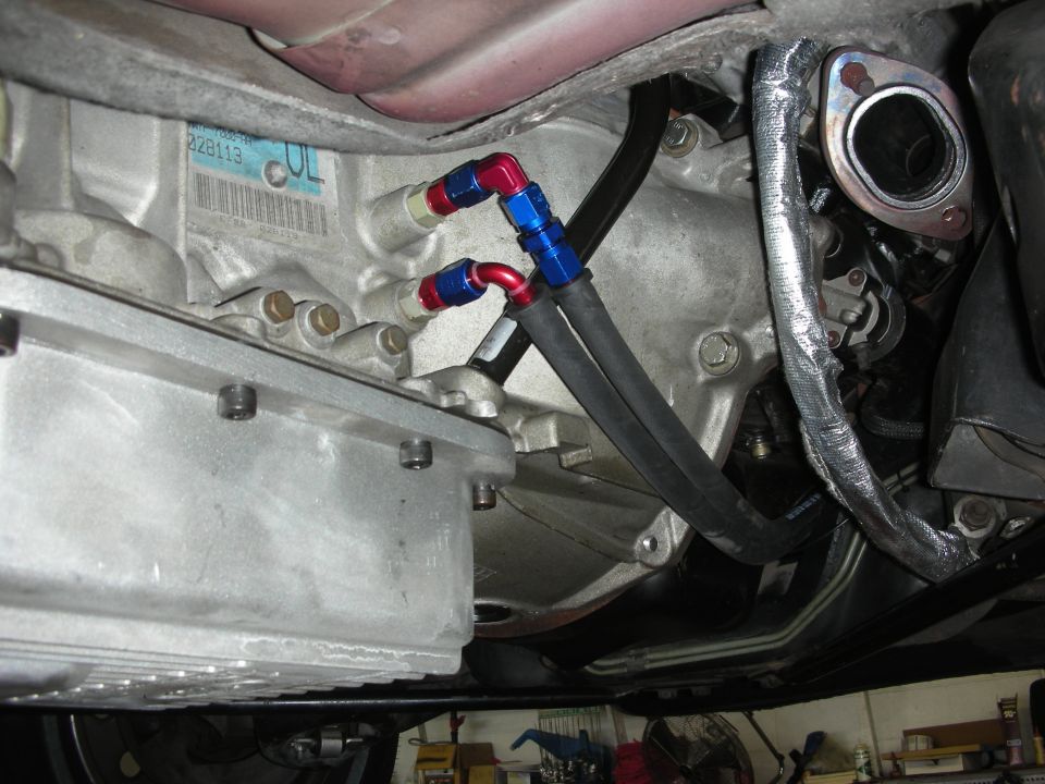 Underside view of transmission with braided oil cooler lines connected