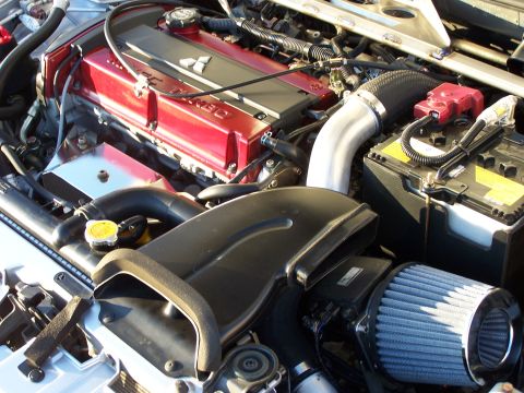 1995 Ford Probe - Detailed view of a car's engine bay, highlighting the intake and valve cover.