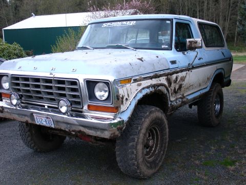 1978 Ford Bronco - This 1978 Ford Bronco is covered in mud, suggesting it has been off-roading.