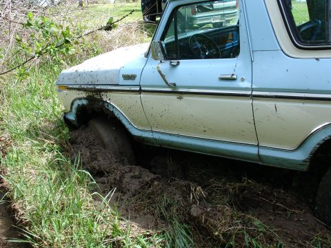 1978 Ford Bronco - This 1978 Ford Bronco is stuck in the mud, with the front wheel submerged.