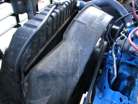 1978 Ford Bronco - Close-up of a vehicle's radiator and fan shroud, showing engine components.