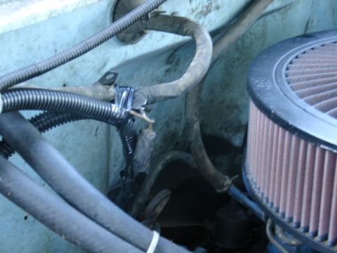 1978 Ford Bronco - Close-up view of engine bay wiring and an air filter.