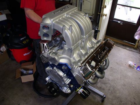 1993 Ford Bronco - A close-up view of a custom engine assembly with prominent Edelbrock branding.