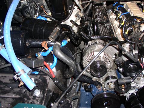 1993 Ford Bronco - Close-up view of an engine bay, showing various components and plumbing.