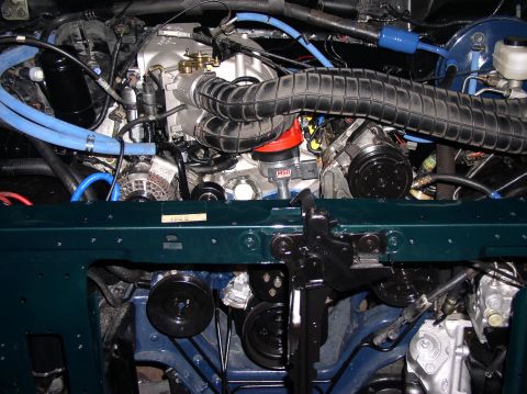 1993 Ford Bronco - The engine bay of a 1993 Ford Bronco is captured in this detailed photograph, highlighting various mechanical components.