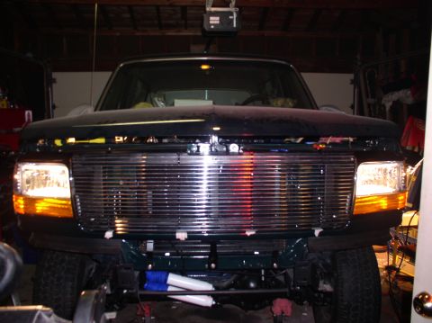 1993 Ford Bronco - Front view of a 1992 Ford Bronco with the hood open, parked inside a garage.