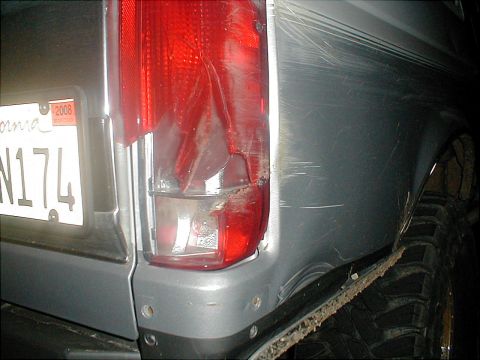 1996 Ford Bronco - This vehicle shows significant damage to its rear taillight and body, with a visible 2008 license plate.