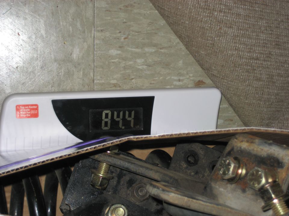 Parts on a digital scale showing 84.4