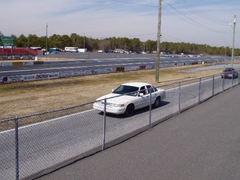 1999 Ford Crown Victoria - A white 1999 Ford Crown Victoria is seen on the track at Atco Dragway during a meet on March 8, 2003.