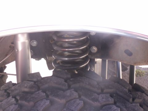 1986 Ford Bronco - This image shows the suspension and tire of a vehicle, not a specific model year.
