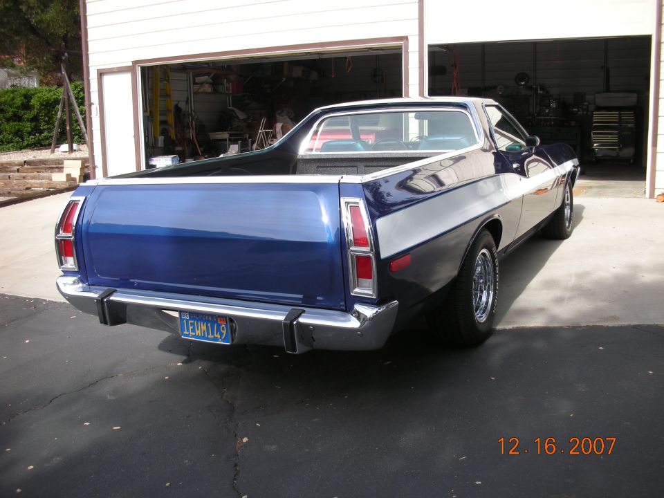 Rear three-quarter view of a blue Ford Ranchero with California plate