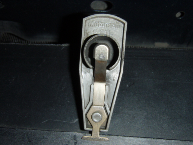 Motorcraft 8-cylinder distributor rotor lying on a dark surface