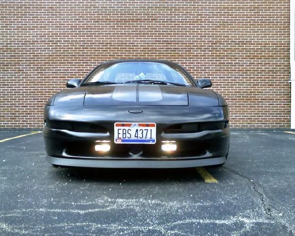 Front view of a black 1993 Ford Probe with license plate EBS 4371
