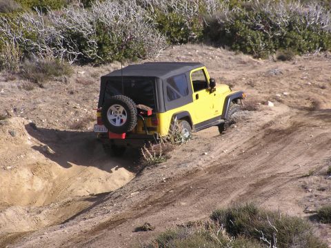1990 Ford Bronco - Yellow Jeep climbed hill
