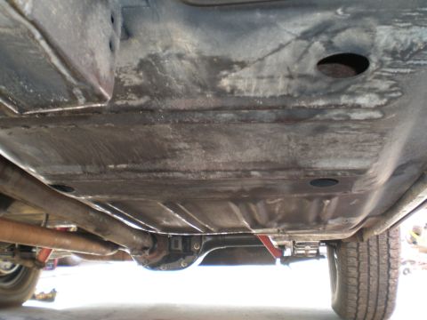 1966 Ford Mustang - Underbody view of a 1966 Ford Mustang, highlighting the chassis components and exhaust system.