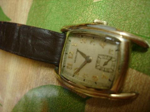 1994 Ford Bronco - This vintage Hamilton watch features a cream-colored dial with gold-tone hour markers and hands.