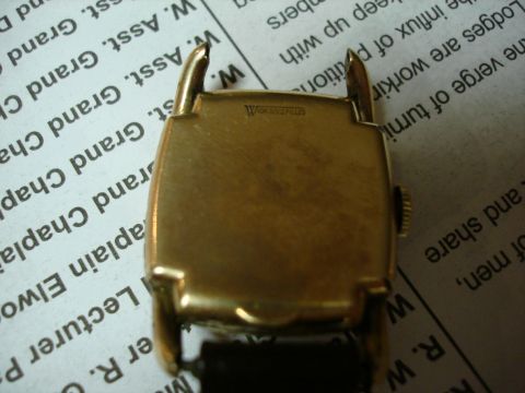 1994 Ford Bronco - Close-up of a watch case back with text visible on the surface.