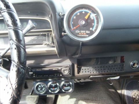 1970 Ford Ranchero - The interior of a 1970 Ford Ranchero features a Sun Super Tach and three additional gauges mounted below the dashboard.