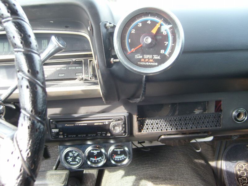 Interior of a 1970 Ford Ranchero with a Sun Super Tach and three auxiliary gauges