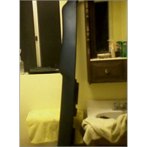 1972 Ford Ranchero - A dark blue trim piece is shown leaning against a wall in what appears to be a bathroom.