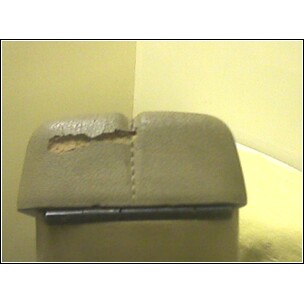 1972 Ford Ranchero - Close-up of a damaged armrest lid with the SuperMotors logo in the corner.