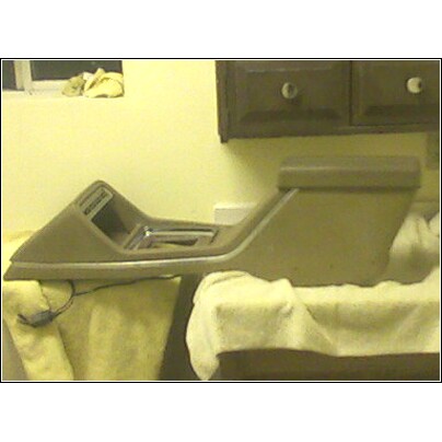 1972 Ford Ranchero - Center console unit with shifter, likely from an older vehicle, placed on fabric.