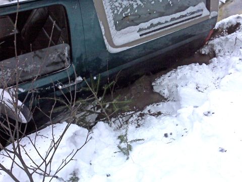 1996 Ford Bronco - This 1996 Ford Bronco is stuck in a snowy ditch.