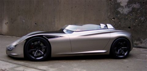 1993 Ford Probe - A futuristic concept car with a , low-profile design is shown from the side.