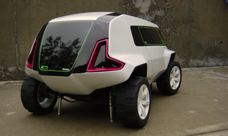 Concept car with large tires and pink and green accents, rear view. Skoda logo visible