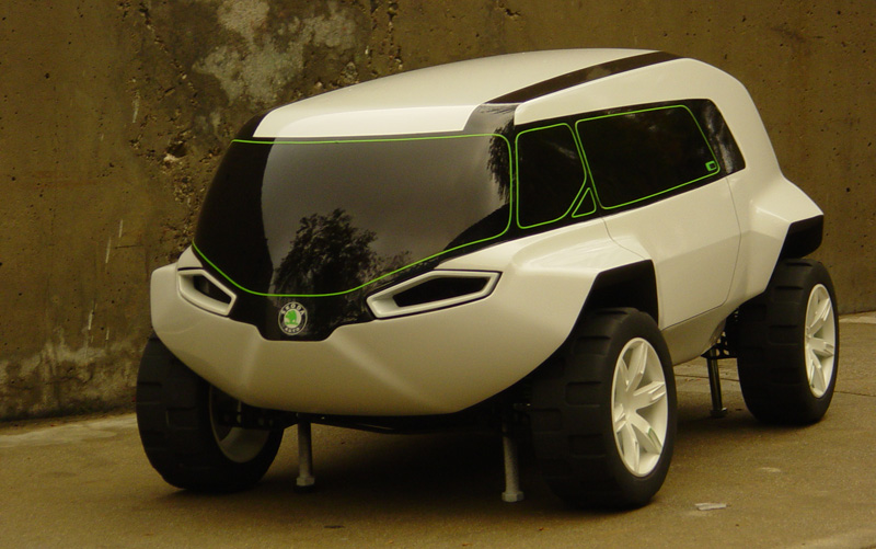 White Skoda off-road SUV concept with green window trim, 3/4 front view on stands