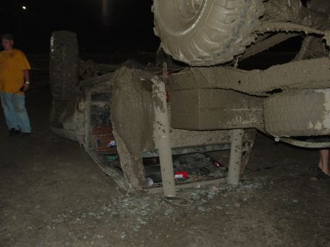 1992 Ford F-350 - This truck appears to have rolled over in the mud, leaving it upside down.