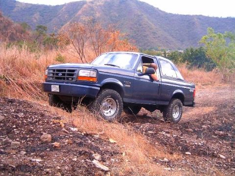 1995 Ford F-150 - This 1995 Ford F-150 is captured navigating a , off-road terrain.