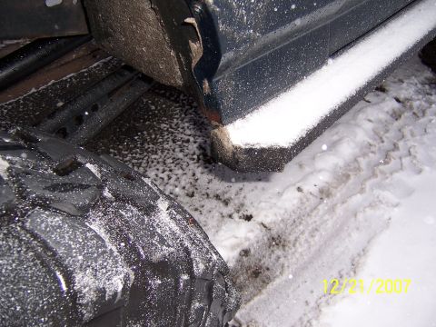 1994 Ford Bronco - Vehicle frame and tire in snowy conditions, with a Supermotors.net watermark visible.
