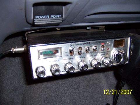 1994 Ford Bronco - Close-up of a Cobra 29 LTD Classic CB radio installed in a vehicle's interior.