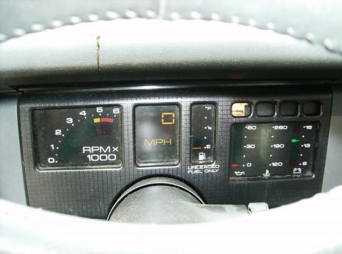 1995 Ford Probe - Dashboard gauges include tachometer, speedometer, fuel, temp, oil pressure, and battery indicators.