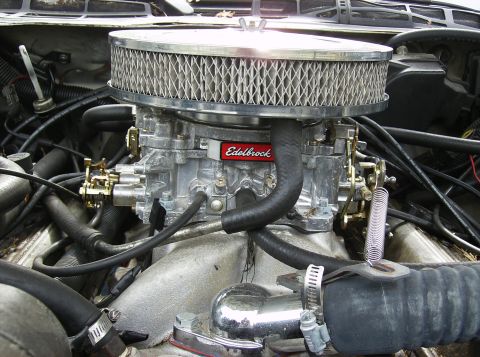 1995 Ford Probe - An Edelbrock carburetor is visible in the engine bay, with a chrome air filter housing and various hoses.