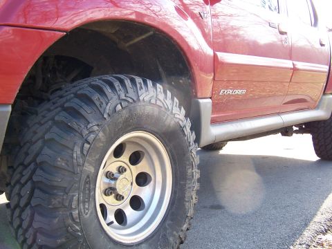 2002 Ford Sport Trac - This 2002 Ford Sport Trac features prominent Explorer badging and is equipped with large off-road tires, suggesting off-road capability.