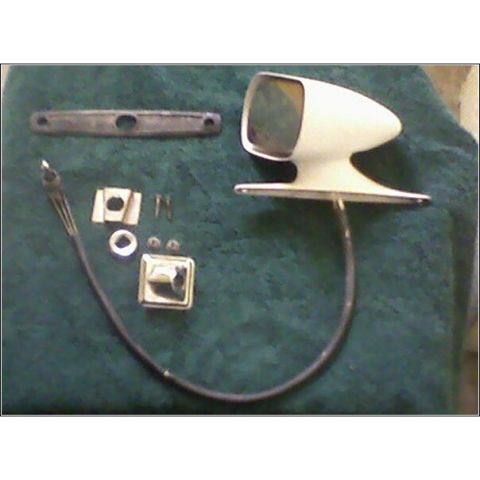 1972 Ford Ranchero - Car side mirror and associated hardware are displayed on a dark green surface.