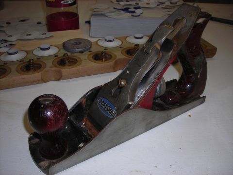 1995 Ford Bronco - A close-up view of a vintage Craftsman hand plane, resting on a surface next to a wooden organizer.