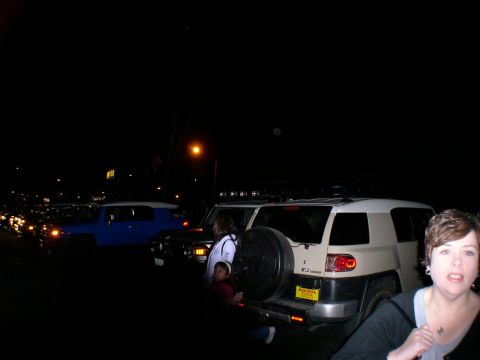 2007 Toyota FJ Cruiser - A tan and white 2007 Toyota FJ Cruiser is parked at night, with other vehicles visible in the background.