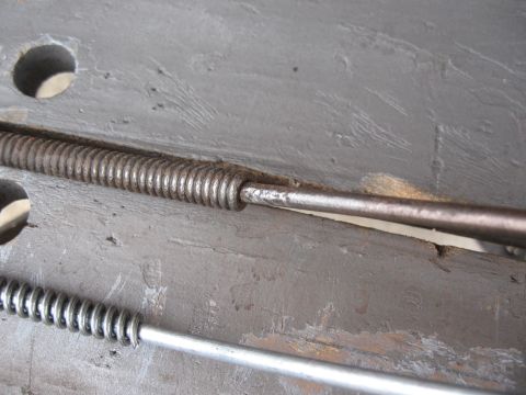 1968 Shelby GT500 - Detail of rear suspension springs and rods, likely from a vintage vehicle.