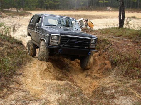 1985 Ford Bronco - Flexing out that TTB suspension, I went down this same wash out and snapped the rear sway bar... after that there was more flex.