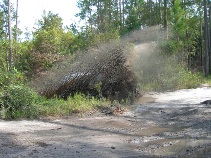 1985 Ford Bronco - Blasting through some mud holes.