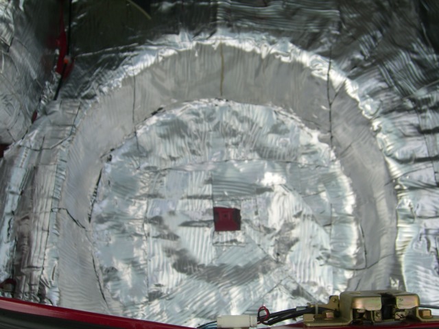 Sound deadening material applied to the interior of a car's rear wheel well